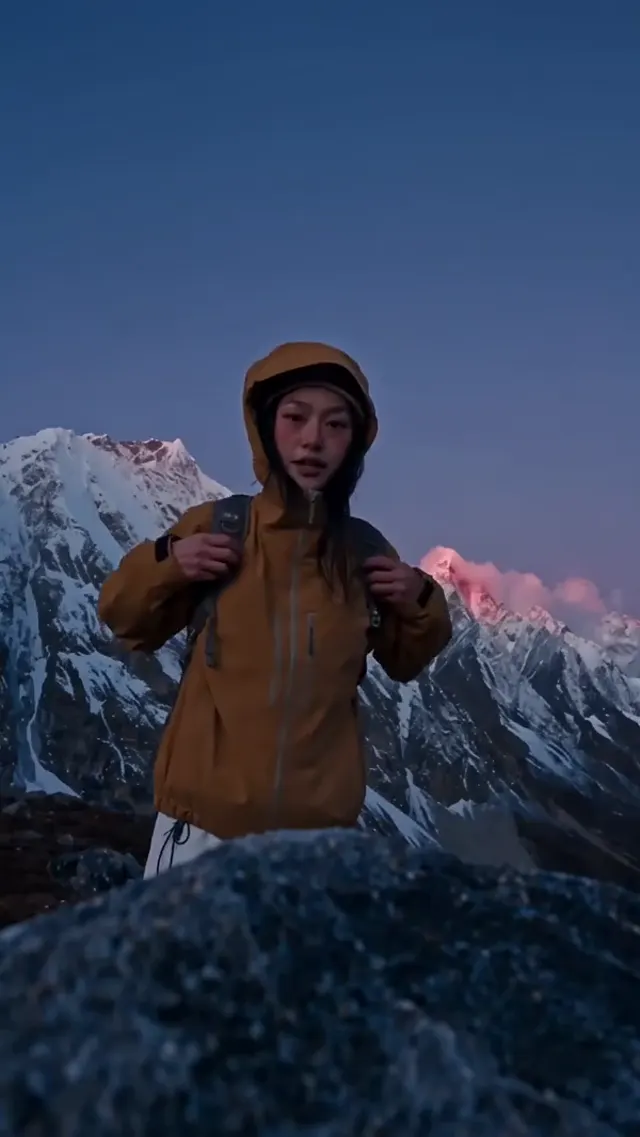 Portrait view of a traveler among snowy mountains